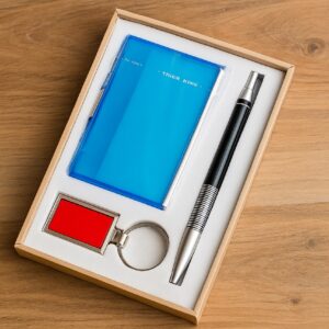 “Blue corporate gift set including a pen, card holder, and metal keychain in a presentation box.”